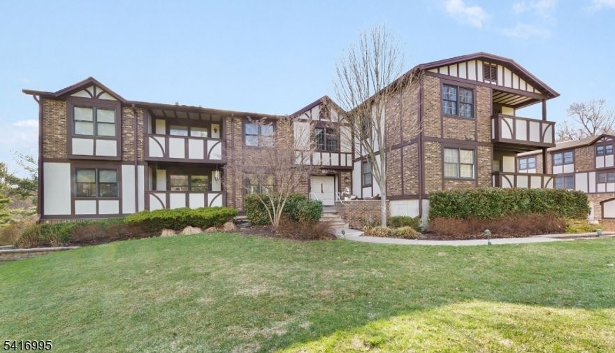 Freshly painted and ready for its next chapter, this bright 2-bedroom, 2-full bath unit offers comfortable one-floor living with just a few steps to the garage level. The spacious living room opens to a private porch overlooking a peaceful, park-like setting perfect for enjoying your morning coffee or unwinding at the end of the day. A formal dining area and eat-in kitchen provide great space for everyday living and entertaining. The primary bedroom features a walk-in closet and its own full bath, while the second bedroom is conveniently located near the full hall bath. Additional highlights include in-unit laundry, private storage, fireplace, one car garage, ample parking and community amenities including an outdoor pool and tennis courts. Ideally located close to NYC trains and buses, major highways, shopping, and top-rated schools.