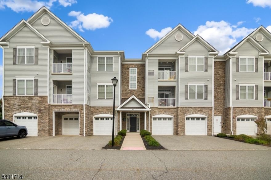 Welcome to Lakeland Village! This spacious 2-bedroom, 2-bath condo offers over 1,300 sq. ft. of contemporary comfort within a beautifully maintained community built in 2016. The open-concept design with high ceilings creates a bright, airy atmosphere, seamlessly connecting the living, dining, and kitchen areas perfect for both everyday living and entertaining. The modern kitchen features granite countertops, stainless steel appliances, and abundant cabinetry. Additional highlights include an in-unit washer and dryer, central air, a private outdoor space, a roomy garage with driveway parking, and a separate storage closet. Ideally located near shopping centers, dining, parks, and major highways, Lakeland Village offers the perfect balance of convenience and tranquility. Move-in ready and immaculate, this home is ready to welcome you just unpack and enjoy.