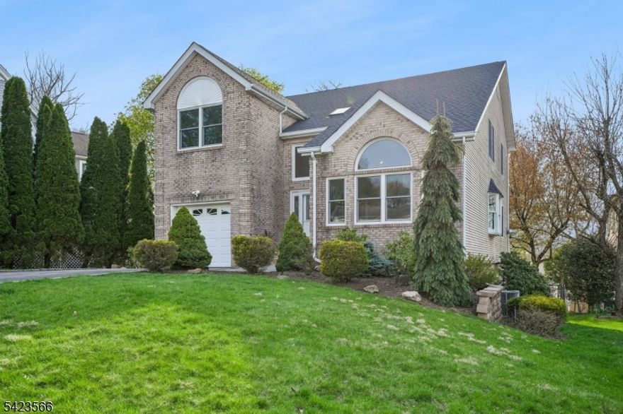 Tucked at the end of a quiet cul-de-sac, this is effortless living at its best. Just over the hill from Montclair and moments from restaurants, shopping, and NYC-bound transit, this beautifully updated home offers the space, flexibility, and ease today's buyers crave - all wrapped in a setting that feels calm, connected, and just right. Across the back of the home, a sunlit kitchen and family room create the true heart of daily life - open, inviting, and designed for everything from busy mornings to slow, easy weekends. It's the kind of space where everyone naturally gathers and lingers. Spacious dining and living areas are filled with natural light, anchored by a stunning arched window that brings warmth, character, and an undeniable sense of joy to the home. Upstairs, 4 well-placed bedrooms offer a sense of retreat and separation from the main living areas - comfortable, practical, and perfectly suited to the rhythm of everyday life. And then, the flexibility everyone hopes to find: a walk-out lower level with multiple rooms and a full bath offers a rare opportunity to live the way you need to - guest suite, home office, playroom, or extended living -all with easy access to the backyard. Outside, the cul-de-sac setting brings a sense of ease - where neighbors connect, bikes roll, and evenings wind down with beautiful sunsets. All just moments from parks, shopping, and NYC-bound bus and train options.Space, flow, and flexibility - designed for the way you live now.