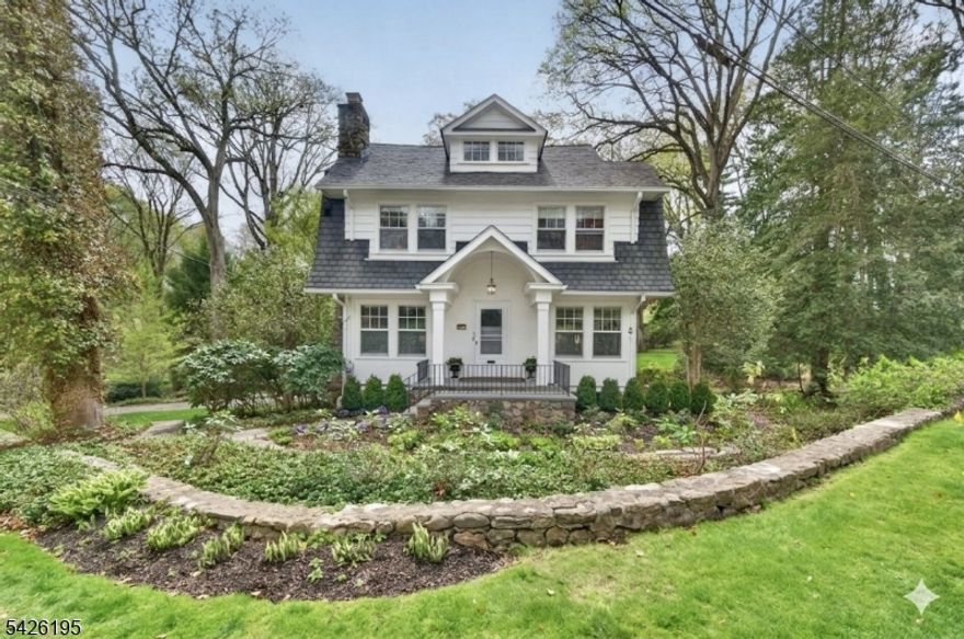 Living the Lake Life! Character & charm abound in this wonderful, 4 Bedroom original Hapgood House in a highly coveted location - only a short walk to the Cove. Beautifully situated on 0.85 acres, this home has been expanded, renovated & meticulously maintained. Hardwood floors, custom moldings, 3 fireplaces & a semi-open floor plan with great spaces for entertaining. Chef's kitchen with top of the line appliances including a 6-burner Garland gas stove, double ovens, Sub-Zero refrigerator, granite countertops, breakfast bar & more.  The fantastic primary suite is a true oasis - boasting high ceilings, two walk-in closets, spacious private bath & a fabulous private office with gas fireplace - all overlooking the serene back yard. Two additional sun-filled bedrooms and a luxurious bath round out the second level; plus a fourth bedroom ensuite on the the upper level with a spacious sitting room. The finished walk-out lower level features a rec room, 1/2 bath, laundry room and plenty of storage. Step outside to relax on the spacious patio overlooking a large, private yard; or enjoy the secret gardens along the gently flowing stream. This home truly offers all the best of prestigious Mountain Lakes - a fabulous neighborhood with lake amenities, walking trails, convenient commuter options and an A+ rated school district. Plus a whole house generator. A true gem!