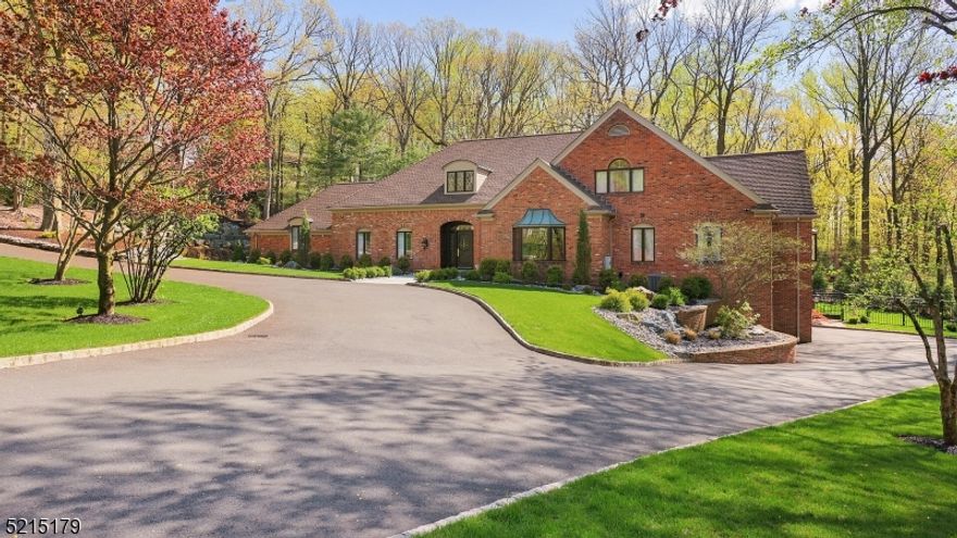 Immaculate storybook manor is ready for your next staycation, or at home entertainment event.  This full brick home is located on a quiet cul de sac, tucked away in the Watchung mountains, & is highlighted by its pristine, meticulously maintained outdoor landscaping, 6 car garage, 6 BRs, &  5.2 BAs.  Bespoke wood trim & custom cabinetry flow throughout the entire property, & elevate its timeless architectural design.  An open concept kitchen complete with stainless steel appliances & prep island lead to a 2 story breakfast nook & sunken living room, each with its own skylight, allowing for sunlight to flood the spaces.  A classic mountain stone fireplace provides warmth & comfort to the stately living room which boasts 4 sets of French doors that open up to the serene backyard oasis.  The 1st floor primary suite offers a spa like en suite complete with an oversized dual head stand up shower, jacuzzi tub, dual walk in closets, & an automatic urinal.  Host the next movie or game night in the fully finished lower level which boasts a movie theater with a wet bar, as well as space for a gym, & a bedroom complete with an en suite and walk in closet.  Decompress and unwind along 2 separate paver patio areas, while overlooking nature's beauty in the fully fenced in, privately wooded backyard space.  New HVAC, roof & hot water heater; Heated garage with epoxy floors; Heated Bathroom floors.