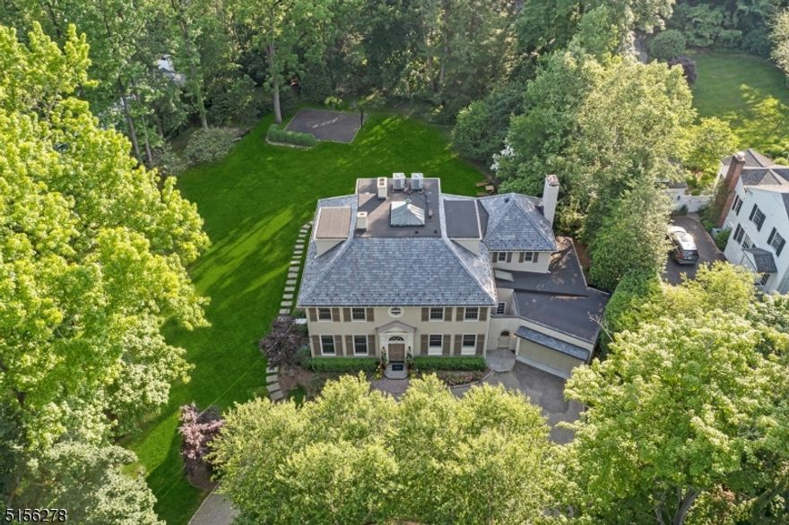 On one of the most highly coveted & picturesque streets in all of Short Hills & on a rare one-acre of property, sits this masterfully designed 7 bed, 4.3 bath architectural gem only blocks to town, top-rated schools & train. This beautifully landscaped level property, complete with a large stone patio and an expansive backyard, has been the perfect setting for intimate celebrations over the years and countless playdates and basketball games. Thoughtfully and timelessly designed, it provides the right flow for seamless indoor/outdoor entertaining, while also offering independent areas for smaller gatherings or work-from-home spaces. Chef's kitchen with custom inset cabinetry, Dacor gas range/oven and microwave, Miele dishwasher, two large refrigerators, and a custom butler's pantry with ample storage. Three finished levels for flexible living and ideal spaces for guests, plus a basement with a rec room, gym, powder room, utilities, and storage. Meticulously updated throughout, improvements include all new Pella windows throughout (2012), new durable DaVinci roof (2007), new gourmet kitchen & all new baths (2009-11), new HVAC system for the guest suite and family room (2009) and two new AC systems with UV filtration system (2021). Absolutely ideal location on not only one of the most picturesque streets, but also only a short stroll to the train, shopping, schools, and the beautiful ponds just down the street.