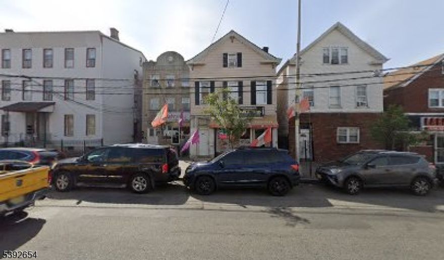 This property is perfect for both investors and homeowners looking to generate additional income. It features a mixed-use layout in a busy retail area. The first floor includes a restaurant that provides a substantial income. The second floor consists of a spacious two-bedroom apartment, while the third floor has a comfortable one-bedroom unit. Recent upgrades include newly installed boilers.