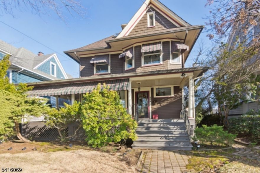 Step into this exquisite turn-of-the-century colonial, built around 1910, that perfectly blends historic charm with modern convenience. Featuring five spacious bedrooms, two full baths, and two half baths, this home offers ample space for both everyday living and entertaining. Enjoy your morning coffee or evening relaxation on the inviting wrap-around porch.  This property is adorned with landscaping that enhances its curb appeal.  Modern Upgrades: This home boasts a brand-new furnace and hot water heater. The updated 200-amp electrical service accommodates all your modern needs.  Large Formal Dining Room is perfect for large gatherings; the spacious dining room offers an elegant setting. The beautiful solid oak pocket doors provide a seamless transition between the living room and dining room. The full basement is partially finished, offering additional space for a recreation area or storage. The enormous third floor would offer the perfect master bedroom suite, complete with an en suite bathroom and skylights. A two-car detached garage is conveniently located off a private lane from Tremont St... The property sits on a spacious 50x150 lot, providing ample outdoor space. The property taxes are $15,764.  Prime Location: Conveniently located within walking distance to the train station and downtown, you'll enjoy easy access to shopping, dining, and commuting!!