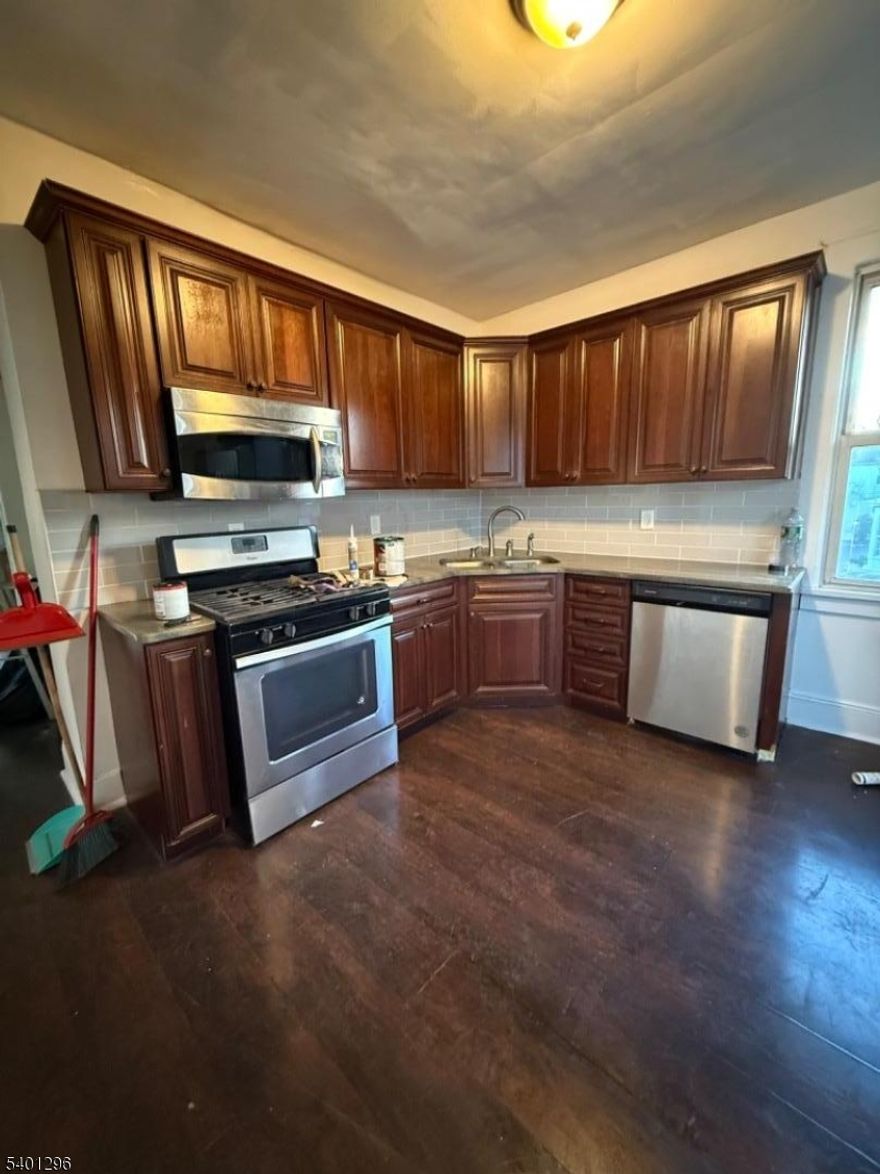 Spacious 2 Bedroom Apartment with Dining Room. Living Room and Closed in Front Porch. Move In Ready with Laundry in the Basement. Just Blocks from Linden Train Station, Shopping and Public Transportation. Great Location.