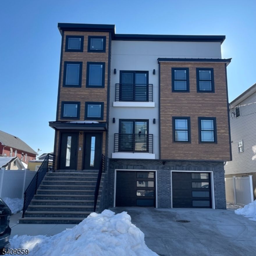 Spacious brand-new construction 2nd-floor apartment for rent. This modern home features 3 bedrooms and 2 full bathrooms, with modern wood floors throughout.Featuring a bright open-concept layout with a combined living and dining area filled with natural light. The eat-in kitchen showcases quartz countertops, a center island, a designer backsplash, and stainless steel appliances. The primary bedroom includes a private en-suite bathroom, walk-in closet, and excellent natural light. Additional features include central heating and air conditioning, in-unit washer/dryer hookups, and one-car parking.Conveniently located near parks, public transportation, shopping, and restaurants. Don't miss the opportunity to live in this thoughtfully finished, move-in-ready home!