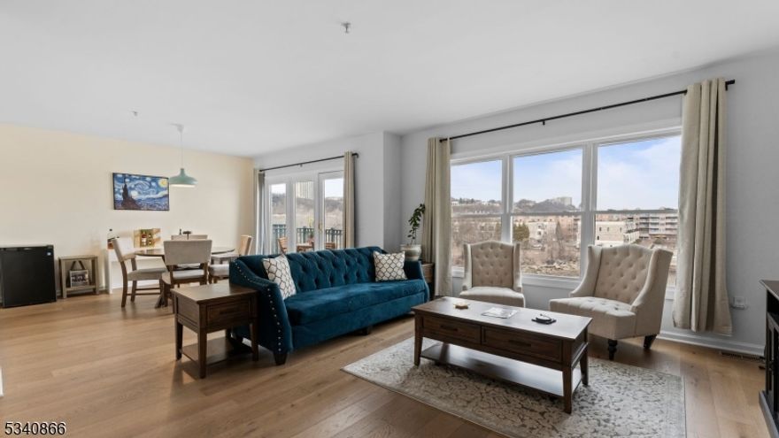 SELLER IS OFFERING A SPECIAL ASSESSMENT BUYER CREDIT! Situated in the heart of Edgewater, New Jersey, The Promenade! Just look at these breath-taking, unobstructed New York City Views over The Hudson River. This Stunning 2 Bedroom, 2 Bathroom Condo Home boasts approximately 1500 Square Feet including Open Concept Entertaining Options and an Outdoor Balcony that are sure to impress!  Location at its best! City Place at The Promenade is the place to be. Featuring an abundance of restaurants, shops, boutiques, and self-care services are only steps away from home.  The Promenade is the perfect blend of endless options in a Private Community.  The Promenade is a Prestigious Gated Community with 24 Hour Security, Assigned Parking, and Elevator Access to all Building Entrances and Walking Paths.  Resort-like Amenities Include a Private Community Room, Fitness Center, Sauna, Jacuzzi, and Locker Rooms.  Seller is motivated, please present ALL OFFERS!