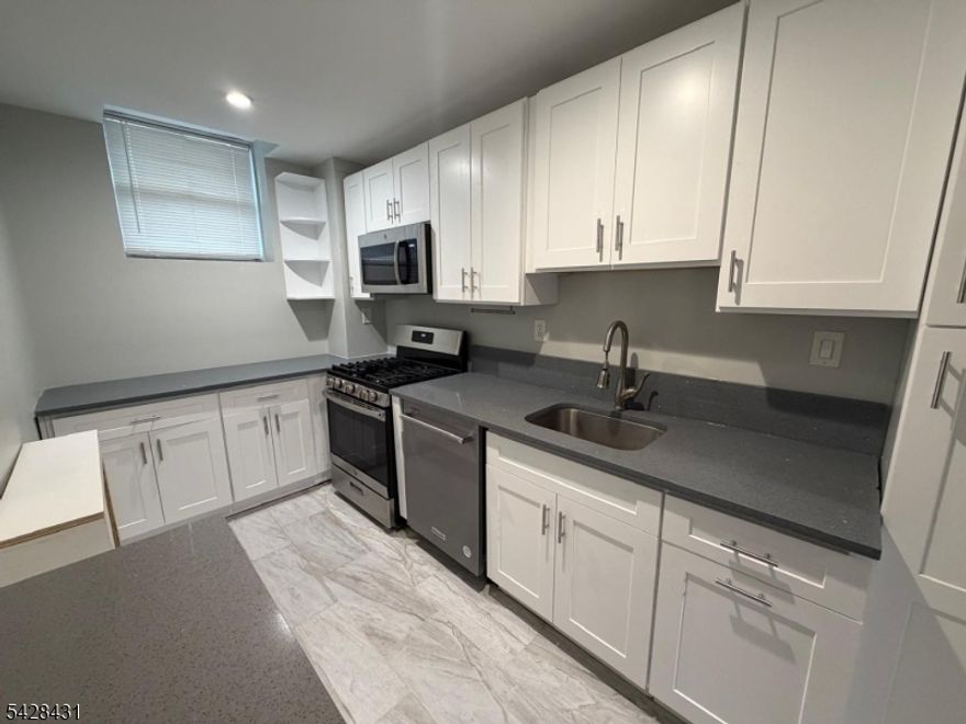 Ground Floor very large renovated unit with private entrance in incredible location. JUST STEPS FROM YOUR FRONT DOOR, YOU'LL FIND AN ARRAY OF VIBRANT RESTAURANTS, CHARMING CAFES, AND BOUTIQUE SHOPS. ENJOY FINE DINING, CASUAL EATERIES, AND TRENDY COFFEE SPOTS ALL WITHIN WALKING DISTANCE, ALONG WITH GROCERY STORES, FITNESS STUDIOS, AND EVERYDAY ESSENTIALS CLOSE BY. THE BUSTLING ENGLEWOOD DOWNTOWN IS ONLY MINUTES AWAY, OFFERING ENTERTAINMENT, THEATERS, AND NIGHTLIFE. FOR COMMUTERS, THE NYC BUS STOP IS LITERALLY AT YOUR DOORSTEP, MAKING TRIPS INTO MANHATTAN SEAMLESS. PARKS, CULTURAL VENUES, AND ENGLEWOOD'S LIVELY COMMUNITY EVENTS ROUND OUT THE APPEAL OF THIS FANTASTIC LOCATION. THE GROUNDS HAS A BEAUTIFUL GARDEN AND GRASS AREA WITH GYM IN THE COMPLEX. HEAT AND HOT WATER INCLUDED. PARKING INCLUDED. Electric and cooking gas is the tenants responsibility.