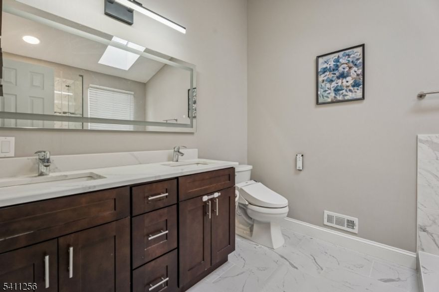 Elegant 2021 Renovated End Unit in The Beacon Hill. Bright, refined, and truly move-in ready. From the moment you enter, abundant natural light and Kahrs Prime Collection Oak Barrel hardwood flooring create a warm yet elevated first impression. Cathedral ceilings enhance the spacious living and dining areas, offering an open, comfortable flow ideal for everyday living and entertaining. The updated kitchen features granite countertops, a classic tile backsplash, and stainless steel appliances, most replaced in 2021. Step outside to your private yard, perfect for relaxing or hosting guests. Upstairs, the primary suite showcases vaulted ceilings, a walk-in closet, and a beautifully updated spa-inspired bath. Two additional bedrooms, a fully renovated hall bath, and a second-floor laundry room with TWO high-end washers complete the upper level with comfort and functionality. All NEW WINDOWS improve energy efficiency and year-round comfort. Residents enjoy access to a pool, tennis and sport courts, playgrounds, and scenic walking paths. Conveniently located near shopping, dining, major highways, and within a highly rated school district, this home delivers style, comfort, and everyday convenience. Ready to welcome you home.