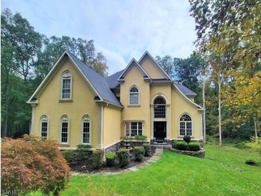 This beautiful custom home sits on over 7 acres, of a wooded lot and was built in a quiet cul d sack. There is a small lake on the property that can be seen from the deck and 2nd level. There is an eat-in kitchen w/ sliding glass doors to a spacious deck. Kitchen has a large center island, white cabinets, S.S. appliances and granite counter tops. Kitchen is opened to family room with 11' ceilings, 6 viewing windows for max natural light, gas fireplace and ceiling fan. There is a formal din room, w/custom window & custom molding. The formal dining room is open to the living/den room. There are double French Doors that open to a private office. A door from the office opens to the 1st fl. powder room. Porcelain designer tiles cover kitchen & family rm. The balance of the 1st floor is covered w/ beautiful dark hardwood flooring. Upper level has a large primary bedroom suite w/ en-suite bath, & very large walk-in closet. The primary bedroom has an area which can be used as a sitting/TV room or exercise room. To complete the 2nd floor. there are 2 generous size bedrooms, main bath w/ tube & shower combo & 2 sinks, laundry room with W/D. Lower level (3rd) is finished w/ a 4th bedroom, full bath, full size windows, w/o to patio, utility room w/ storage. There is a 3-car garage w/ lifts for additional parking if required. This is without a doubt a VERY special rental opportunity.