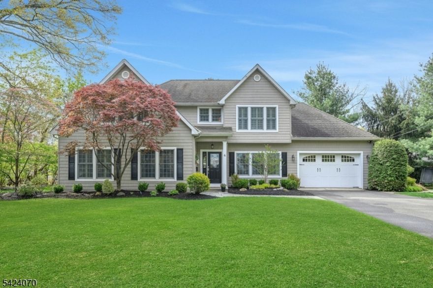 As you make your way down the street, you are immediately met with undeniable curb appeal -the kind that stops you for a moment. Picture perfect setting and thoughtful landscaping speaks to the meticulous care that defines the entire property. Once inside you'll know you are in a place meant to gather and make lifelong memories. Sunlight filters through the plantation shutters highlighting the special details of the home. Warm dining room for special days. Living room with gas fireplace has space for all, with doors leading to patios. Warm den and bedroom offer first floor flexible living spaces. Kitchen with center island has everything you need. Mudroom to keep items tidy off the garage. Primary suite is peaceful, with large walk in closet and laundry room. Ensuite has large shower and double sinks. Three additional spacious bedrooms and hall bath. Family room is perfect for game night or watch a movie in the media room, complete with recliners and dry bar. A natural flow from inside to the outdoor living space, intentionally designed for enjoyment and entertaining. Feels like a private retreat with different gathering spaces. Perfect for dining al fresco, lounging, special celebrations and hosting under the stars. Professional landscaping includes elegant uplighting for the front yard trees. This neighborhood is a hidden gem in top rated Mountain Lakes. Walking trail down the street. Walk to the park, restaurants, train, and library.