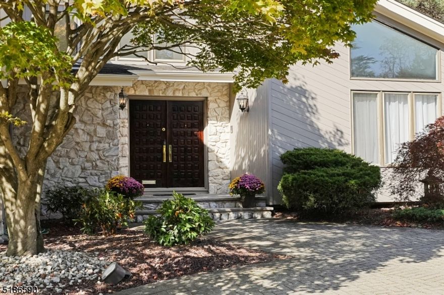 Stunning, spacious contemporary home with 5 bedrooms on resort like grounds in prime Chestnut Hill section. Clean lines, open layout and high ceilings with abundant natural light from windows and skylights. Easy flow between kitchen, family room, dining and living areas plus outdoor spaces is perfect for everyday life and entertaining.  Large private, level and fenced backyard with in-ground pool, spa, gazebo, deck and patios surrounded by mature landscaping creates a private oasis. Beautiful luxury eat-in kitchen with island, granite counters, custom cabinetry and butler's pantry opens to large sunken family room with cathedral ceiling, fireplace and spiral staircase to loft library.  Four large bedrooms on 1st floor including master suite with dressing room, walk-in closets and large bath with separate tub and shower.  Huge lower level with high ceilings includes guest bedroom, bath and closets for possible in-law or nanny suite, rec room, large office/conference room, tech support room with Ethernet hub, laundry, wine room plus significant additional storage. Hardwood floors, updated lighting, moldings complement many updates. Circular paver driveway in front and expansive three car garage.  Top rated Livingston schools and excellent location near to NYC commuting, shopping, houses of worship, hospitals and more.