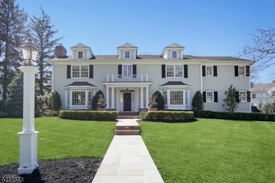 Picture-perfect home on one of the most desirable blocks in the sought-after Rolling Hill section. The best of indoor and outdoor living. Stately exterior and mature landscaping with exterior lighting. Outside living space completely redone with a full kitchen, gas fire pit, and blue stone patio plus portico. First floor offers large eat-in kitchen with high-end appliances adjacent to family room with wood burning fireplace. Expansive grand living room offers a second wood-burning fireplace opening up to sunroom. Dining room connects right into the butler's pantry. Impressive wood-paneled office finishes off the 1st-floor layout. Basement boasts media room with projection screen theater, full bar, temperature-controlled wine room, exercise room, play areas, full bathroom, and radiant floor heating. Five bedrooms and 5.5 bathrooms in total. Primary bedroom features expansive bathroom, gas fireplace, built-ins with window seat, closet systems, and a walk-in closet. Primary bathroom has stunning soaking tub, large stall shower, and two sink areas. Four additional bedrooms on the second floor: two are en suite and two share Jack & Jill bathroom. Built-ins throughout and thoughtful space in the two mud room areas to keep and stay organized. Laundry room on second floor.  Spacious layout for each of the five bedrooms and connecting hallways. Whole house generator, speaker system inside & out, oversized two-car attached garage complete with cabinet system. Classic colonial stunner.