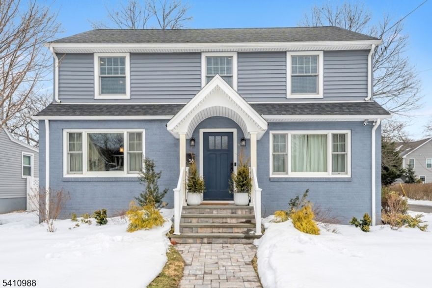 Exceptionally renovated Colonial in one of Metuchen's premier neighborhoods, just 0.2 miles from the NYC train. Fully taken to the studs in 2022, this three-bedroom, 2.5-bath home features modern systems and enduring finishes: new roof, Andersen windows, two-zone HVAC, recessed lighting, and gleaming hardwood floors throughout. The gourmet kitchen boasts quartz counters, a seating peninsula, high-end stainless appliances with hood exhaust, pantry, dual sinks, wine fridge, and a bright breakfast room with French doors to the yard. The main level offers formal living and dining rooms plus a convenient powder room. Upstairs, the primary suite includes an en-suite bath and walk-in closet, with two additional bedrooms, a full hall bath, and second-floor laundry. A walk-up attic and full basement present strong potential for added finished living space. Outdoors, enjoy a private deck, patio, and an oversized two-car garage (2022) prewired with 220V for future EV charging. Prime location, turnkey condition   showings by appointment.