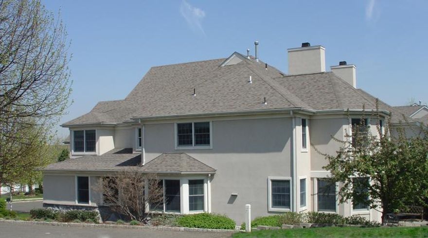 Welcome to the highly sought after Estates Section of Montclair and this exceptional Tudor, where timeless elegance meets contemporary comfort. The heart of the home features a chef's kitchen and great room, opening to a beautiful deck, a stone patio with firepit, and a fully equipped outdoor kitchen all overlooking a sparkling gunite pool, pool house, and an expansive, landscaped backyard.  Inside, the first floor includes a gracious living room with a wood-burning fireplace, a formal dining room, a cozy family room, and a dedicated home office.Upstairs, the 2nd floor boasts a luxurious primary suite with an en suite bath, walk-in closet, and its own wood-burning fireplace. 2 additional bedrooms share a Jack and Jill bath.  The 3rd floor offers 2 more bedrooms, full bath, and a stunning bonus/playroom with soaring ceilings, ideal for a creative retreat or play space.  The fully finished walk-out basement completes the home with a gym, laundry room, and an additional recreation room.This one-of-a-kind home is truly an entertainer's dream or your own private sanctuary.