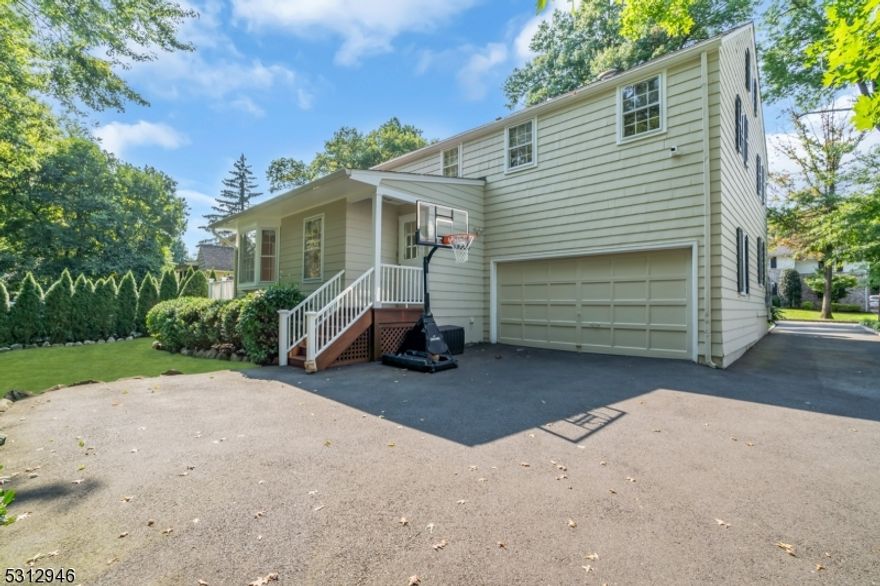 Welcome to this stunning colonial home located in the desirable Summit. This home boasts beautiful hardwood floors throughout, a gas fireplace, an updated primary bath and skylights that fill the home with natural light. 15 Glen Oaks provides ample attic space, a partially finished basement, a breakfast nook and so much more.  Step outside onto the gorgeous outdoor deck, ideal for entertaining or simply relaxing. With its convenient location close to downtown and the NJ transit line to NYC, this home offers both charm and convenience. Don't miss the opportunity to make this your dream home!