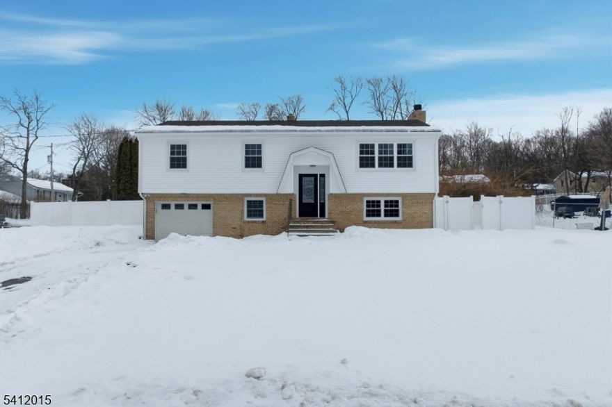 WOW! This is the one you've been waiting for! Welcome to 1 Sunset Terrace in Vernon Township, located in the desirable Cliffwood Lake community and offering the dream home lifestyle buyers are searching for. The upper level features a bright living room, spacious dining area, and a beautifully updated kitchen with modern white cabinetry, stainless steel appliances, upgraded quartz countertops, and a stunning backsplash, along with three generously sized bedrooms and a full bathroom. The lower level provides incredible versatility with a fourth bedroom, half bathroom, large family room/den, laundry room, garage access, and a bonus room perfect for a home office, gym, or playroom. Tucked away in the peaceful Stockholm section, this home blends privacy, nature, and modern comfort while offering lake amenities and year-round recreation just minutes from Mountain Creek Resort, plus easy commuting access via Route 23 and close proximity to shopping and dining. Whether you're looking for full-time living or a weekend retreat, this home has it all--schedule your private showing today before it's gone!