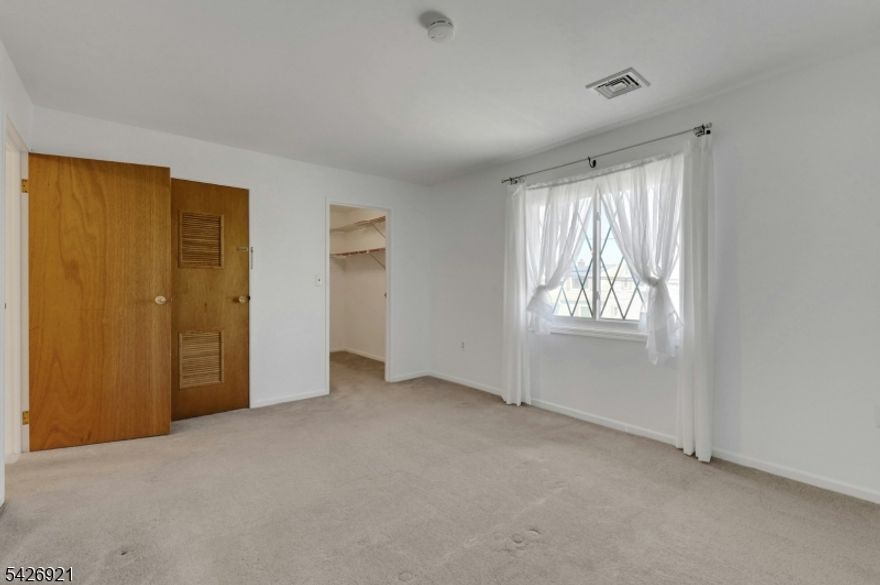 Lovely 2 BR condo close to Bergen County Park.  Move right into this freshly painted end-unit with newer kitchen and central a/c unit. Bright  & sunny unit features newer windows and roof. The open concept LR/DR and kitchen combo is perfect for entertaining. The King size BR and walk-in closet and in-unit washer/dryer add to the  allure of this well-designed condo.  Close to parks, shopping, houses of workship and NY transit.  Pet friendly!  One dog or cat less than 15 lbs permitted.