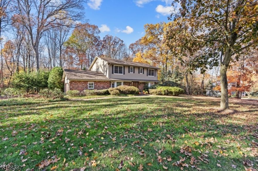 This Spectacular & Beautifully Appointed Center Hall Colonial is nestled in the desirable Powder Mill Section. Picture Perfect Neighborhood & Tree Lined Streets with curbs & sidewalks. Flowing, classic layout great for entertaining. Oversized foyer is bookended by formal living room & dining. Both boasting large picture bay windows. Modern kitchen w/marble counters, glass tile backsplash, center island, ultra white shaker-style cabinets, farm sink, high end SS appliances (plus wine fridge) & natural gas cooking which opens to the FR w/brick faced fireplace. French doors lead to the stunning & sun filled 4-season Conservatory w/corner floor to ceiling stone stacked gas fireplace. Convenient powder room & laundry/mudroom. Gorgeous dark HW flooring throughout w/moldings. Custom mission style lighting. Upstairs 4 large bedrooms - ALL w/walk-in closets including a primary suite which boasts 2 closets & a stunning en-suite w/ stall shower. Finished basement- bonus living w/rec room, den & full bath. Partially unfinished for storage & workshop. Large 2 car garage provides even more storage. Newer furnace. Nice paver patio & lawn! Backyard offers a ton of privacy. Situated in a great location with easy access to all life's conveniences- close proximity to NYC-Direct train station (Morris Plains or Denville), bus stops, shopping & parks. Enjoy bustling Dwtn Denville, Morristown or choose to visit historic Mt Tabor. EZ access to major hwys, mass transit & top-rated Parsippany schools.