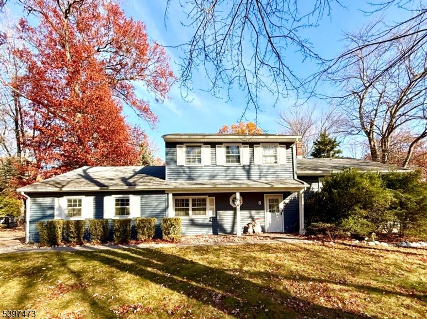 This stylish, distinctive 5-bedroom home sits in a coveted neighborhood. First floor bedroom/office/den with walk-in closet and spacious family room with access to one of the two patios. The bright updated eat-in kitchen features a Pergo flooring, a breakfast bar, and a new rang hood vented to the outside. The formal dining room has a high ceiling with a paddle fan and French doors out to the second patio. The living room is raised with new Pergo flooring and a large picture window. Upstairs are four large bedrooms with new flooring and two beautiful remodeled bathrooms. The home has natural gas heat and central air conditioning. Basement with new washer/dryer and new water heater. Beautiful paver driveway leads to a two-car garage. This home is located on a large corner lot with a built-in sprinkler system and is convenient to major highways, shopping and schools.