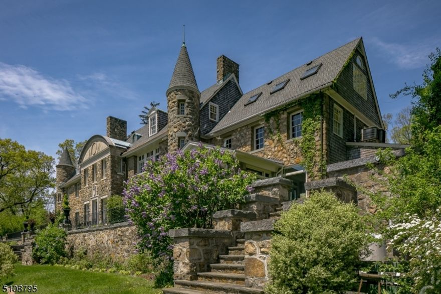 The magnificent Somerset Hills panoramas and incredible sunrise views from this stunning elevated vantage point are rare. Architecture rendered in stone, complete with turrets and towers, lends a sense of whimsy to the Craigmore estate. Over 12,000 square-feet of living space is arranged on three formal floors, befitting the baronial lifestyle of former owner Charles Engelhard Sr. The floor plan flows easily from one breathtaking space to the next.  Highlights of the layout include 7 fireplaces, flooring of oak in select rooms, high ceilings, and multiple sets of french doors opening to view-filled bluestone and grass terraces. There is a sunken conservatory overlooking stunning countryside vistas, a welcoming center island kitchen connecting to the breakfast and family rooms, and a partially finished basement with a temperature-controlled wine cellar and two insulated storage rooms. On the second floor's flexible layout, six bedrooms include a primary suite wing. Originally utilized for staff members, the third floor is currently arranged as two wings. One wing provides an oversized office and bedroom with full bath; the other a den, office, studio and two full baths plus an expansive recreation or exercise space.  An elevator services the 1st & 2nd firs. Stone terraces and patios step down to a heated pool with fountains, a koi pond and gardens, all providing a perfect venue for warm weather entertaining. In the front there is a stone wall enclosed courtyard with fountain.