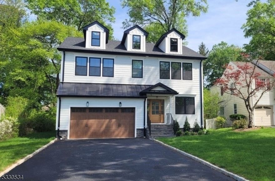 For Comparable purposes, this home already sold. Colonial home with 6 bedrooms,5 full bathrooms, Open concept floor plan, 9' ceiling height on 1st floor, 9' with tray ceiling on 2nd floor, and 8' in the basement, Full finished basement, bedroom with above grade window, full bath, large open area, and ample storage, 2 car garage, Indoors,Custom modern black-faced staircase with custom balusters, White Oak 7" wide plank Hardwood floors throughout. Mudroom area with cubbies, bench, and hooks,12' Sliding doors in family room leading to Trex deck. Kitchen Fabuwood shaker white double cabinets to ceiling with Fabuwood crown moldings, soft-close drawers, brushed gold hardware. Black Fabuwood large center island. White quartz countertops. Combination of black, gold, and chrome hardware. Primary bedroom with walk-in-closet with custom cabinetry with custom trim. Natural Gas fireplace in Family room, Electric fireplace in basement entertainment area. Custom trim designs throughout. Trimmed ceiling in living room and dining room, 2nd floor laundry with sink and cabinetry, 3-Zone heating and cooling with Nest. Each floor on separate zone.Wired full surround sound speakers with exterior security cameras.Outside, Hardie plank siding board and batten accents around entire house. Mahogany front door, Custom black exterior/black interior windows,Trex deck with black aluminum railings. Paved driveway with Belgian block curbing and paver walkway.