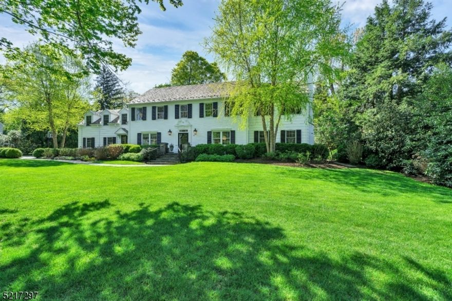 Proudly situated in Madison's coveted Hill Section, this stately Georgian colonial is the home that you've most-likely admired for years. With its classic white brick, slate roof, winding bluestone walkway, and professionally-designed landscaping this home is noteworthy. Immaculately cared for and updated, this 5 BR, 3.5 bathroom beauty has pristine hardwood floors, 2 FPs (one gas/one woodburning), intricate woodwork, and many updates. A generous foyer is the perfect introduction to this show-stopper. A comfortable den/office off of the foyer is outfitted with custom built-ins, a window seat bench and lots of light. Adjacently positioned is the welcoming kitchen with a center island, custom cabinets, and separate sun-drenched breakfast nook. A front/side entry door is perfect for casual company and leads to the back staircase with direct access to the 5th BR upstairs.  The large living room is expansive and has a beautiful masonry wood-burning fireplace. Another place for gathering is the family room with its rich woodwork and GORGEOUS wall of custom French doors that lead to one of the two bluestone patios. The 2nd flr is home to 5 bedrooms and 3 full bathrooms. A gorgeous primary suite is its own oasis. With an office with custom built-ins and lovely view of the backyard, a large walk-in closet and a spa-like bath with jacuzzi tub, large shower, & double vanity this is truly luxury living. The basement has a rec. room w/custom built-ins an exercise area, lots of storage.