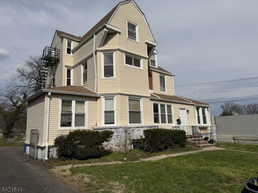 Large two-family home with 7 bedrooms on a deep 62 x 200 lot. Prime location close to shopping, public transportation, and direct access to New York City via bus and train. The property offers spacious rooms throughout and is a great opportunity for buyers looking to add value with updates and improvements.