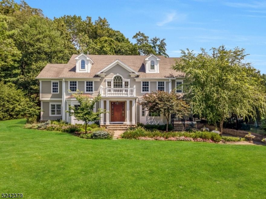 Built in 2009 and ideally situated on a quiet tree-lined street in the highly sought-after Hartshorn section of Short Hills, this spectacular residence boasts over 6,000 square feet of impeccably designed living space. As you step through the stately front door, you are greeted by a majestic foyer that serves as the gateway to the various treasures offered by this inviting home. Built to exacting standards by a prestigious local builder, the craftsmanship is immediately apparent -- finely detailed millwork, gleaming hardwood floors and soaring ceilings all attest to the quality and attention to detail. The large open floor plan impresses with a stunning two-story foyer, first floor office, first floor bedroom, two gas fireplaces and a spacious family room next to a gourmet kitchen where no expense was spared. Upstairs, the luxurious primary suite serves as a sanctuary with its gas fireplace, oversized walk-in closets and sumptuous en-suite bath. Additional bedrooms are generously proportioned with ample closet space as is the second floor laundry center. A wonderful lower level with bedroom, two rec rooms, full bath and half bath offers plenty of space for all, while an oversized 3 car garage offers endless storage. Outside, the bespoke experience continues with an expansive deck overlooking the generous grounds, while thoughtful upgrades include a built-in gas generator to ensure the fun never ends. Just steps to the Hartshorn elementary school and its expansive grounds.