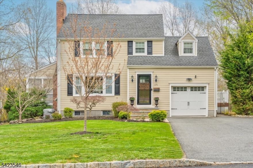 Recent renovations thoughtfully designed for today's lifestyle make this home truly move-in ready. Featuring new windows, durable HardiePlank siding, and beautiful hardwood floors, including new flooring on the first level, this home offers both style and lasting quality, all wrapped in exceptional curb appeal. A welcoming vestibule with a coat closet leads into an open-concept layout ideal for modern living. The sun-filled living room features a wood-burning fireplace and a large picture window, seamlessly flowing into the dining room with sliders to the deck, perfect for indoor-outdoor entertaining. A bright screened porch also opens to the deck, creating additional space to relax and unwind. The spacious, updated kitchen is equipped with stainless steel appliances, granite countertops, and a convenient coffee bar. A powder room and side entrance complete the main level. Upstairs, you'll find three bedrooms, including a primary suite with an updated en suite bath, and a hall bath and a spacious linen closet. Idealy suited for gatherings or quiet enjoyment, the exterior offers a large, level yard with a paver patio and attractive hardscaping. All this plus a prime location close to downtown, top-rated schools, and Midtown Direct trains for easy commuting.