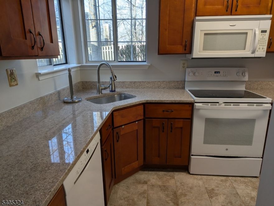 Neutral decor - newer kitchen appliances & cabinetry. Additional MBR vanity. Very private location at end of cul-de-sac. Easy access to Rtes 78 & 287. Nearby shopping. Sewer fee = $80/month Ceramic-tiled entry foyer & kitchen floor; granite counters in kitchen.  Laminate flooring 2017.