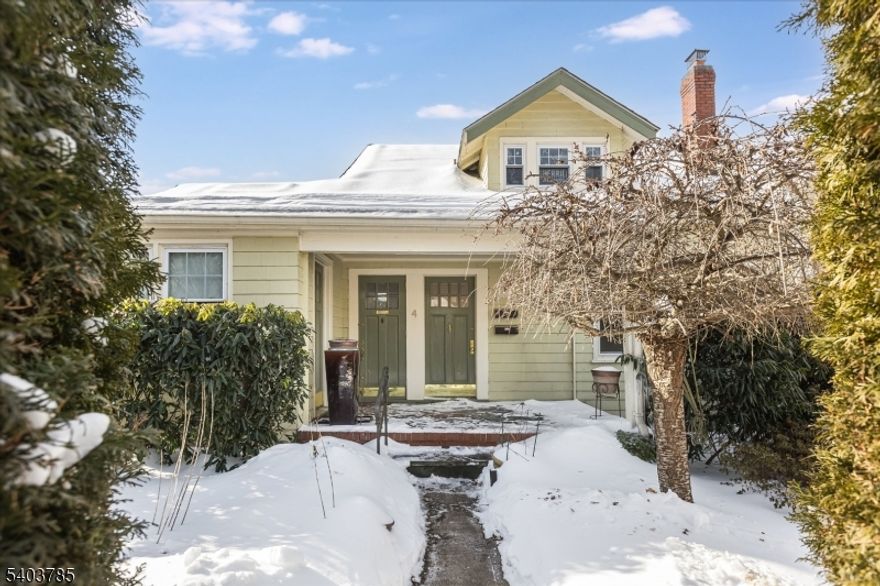 A beautifully renovated and freshly painted two-bedroom apartment in an unbeatable location, close to charming Maplewood Village, the NYC train, Columbia High School, shopping, parks and dining. This pristine ground floor unit is bathed in natural light, and features classic wood floors, a fabulous beamed ceiling, separate dining room, totally renovated kitchen with brand new appliances and a stackable washer/dryer right in the unit for total convenience. You'll also enjoy use of the sweet covered front porch and easy off-street parking in the private driveway. NOTE: The apartment is zoned for both residential and commercial use, so the possibilities here are endless!