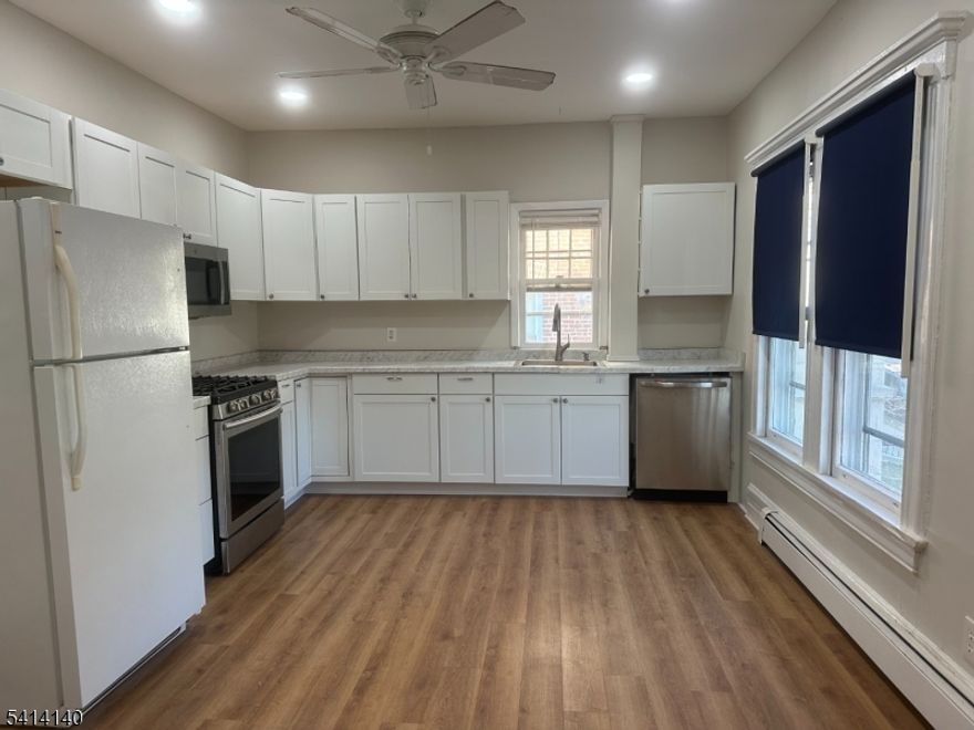 Welcome home to this elegant and inviting two-bedroom apartment, ideally located on the second floor of a well-maintained multi-family residence just moments from vibrant downtown Montclair. This bright and spacious unit features a beautifully renovated kitchen with modern finishes, a formal dining room perfect for gatherings, and a generously sized living room ideal for both relaxing and entertaining.Both bedrooms offer ample closet space, providing comfort and functionality. The apartment also includes laundry and dedicated storage in the basement for added convenience. Parking for two cars is available, a rare and valuable feature in this prime location.Situated close to shops, restaurants, and major transportation options, including easy access to Walnut Street Station, this home offers the perfect balance of charm, comfort, and accessibility.