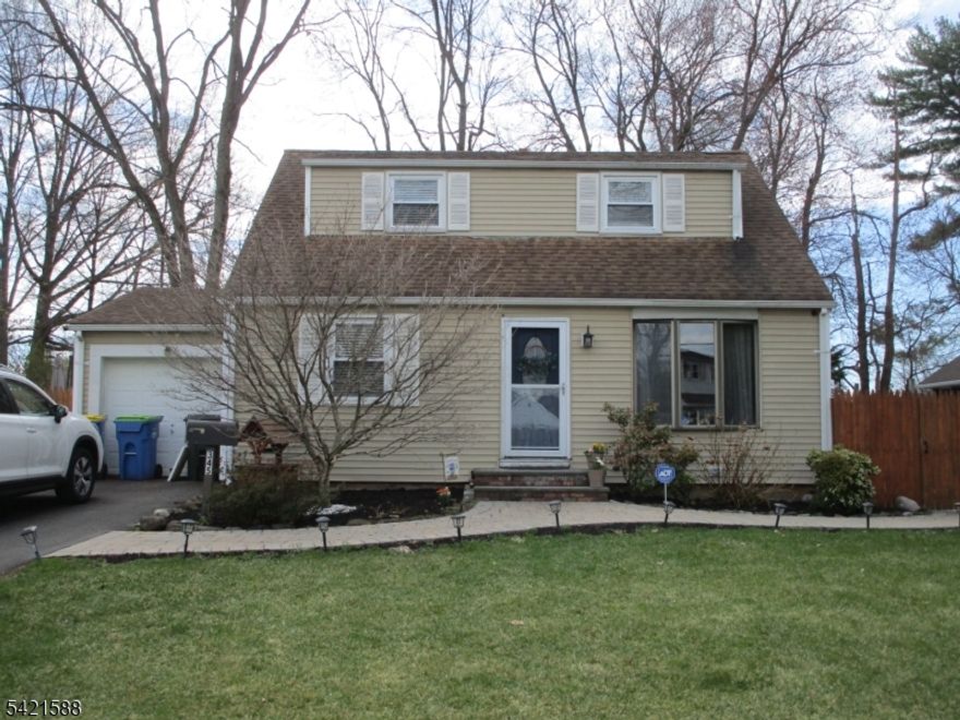 This pristine Cape Cod has been updated, lovingly maintained and is now ready for its new owner.  Located on a quiet peaceful street, yet only a short distance to Route 22 and Costco, providing convenient, accessible shopping.  Commuting is also available on the Raritan Vally line via nearby Dunellen Station.  Enter into the spacious living room which welcomes you and flows seamlessly into the kitchen at the rear of the home. Hardwood floors run throughout the first floor, which also features a dining room, bedroom and updated full bathroom.  The second floor features two bedrooms.  The basement is high and dry, waterproofed with french drains, and offers a versatile space for recreation and can be finished into additional living space.  Step outside to the patio and large private yard, sufficient for a large gathering, or simply relaxing outdoors.  Ample off-street parking in the newly paved driveway and garage.