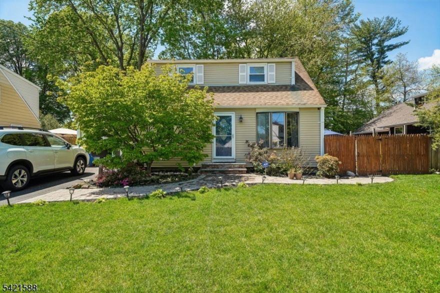This pristine Cape Cod has been updated, lovingly maintained and is now ready for its new owner.  Located on a quiet peaceful street, yet only a short distance to Route 22 and Costco, providing convenient, accessible shopping.  Commuting is also available on the Raritan Vally line via nearby Dunellen Station.  Enter into the spacious living room which welcomes you and flows seamlessly into the kitchen at the rear of the home. Hardwood floors run throughout the first floor, which also features a dining room, bedroom and updated full bathroom.  The second floor features two bedrooms.  The basement is high and dry, waterproofed with french drains, and offers a versatile space for recreation and can be finished into additional living space.  Step outside to the patio and large private yard, sufficient for a large gathering, or simply relaxing outdoors.  Ample off-street parking in the newly paved driveway and garage.