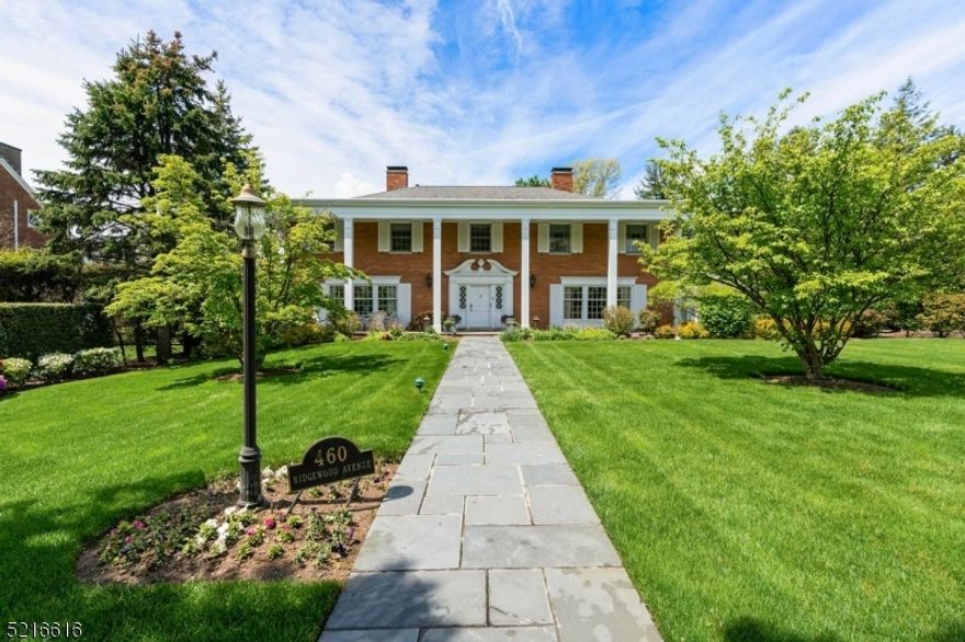 Indulge in the pinnacle of gracious living in this remarkable stately brick Colonial that seamlessly blends practicality & sophistication. From the moment you enter, you'll be captivated by soaring cathedral ceiling, dramatic staircase in entry hall, and classic living room that exudes elegance. Perfect for entertaining, the formal dining room comfortably accommodates 12 guests, while the inviting family room features a cozy wood-burning fireplace, a built-in bar, & a stereo system. The custom eat-in kitchen is a culinary enthusiast's dream, boasting granite counters, stainless appliances, an indoor barbecue, double oven, & sliding doors that lead out to the rear patio. Completing the first floor is a powder room and a convenient laundry room. The second floor comprises five sunlit and spacious bedrooms, each with its own private bath. Two of these bathrooms feature luxurious whirlpool tubs & stall showers. Descend to the lower level, where you'll find an impressive entertainment room with gas fireplace, a wet bar, his & hers powder rooms, and generously sized finished recreation room & exercise area. Outdoor enjoyment is easy on the sprawling stone patio featuring built-in barbecue & fire pit area, overlooking beautifully landscaped grounds. The 3-car garage with storage loft provides convenient entry to both the first floor and lower level. Located in a sought-after area with top-rated schools & NYC transportation at your fingertips, make this dream home complete.