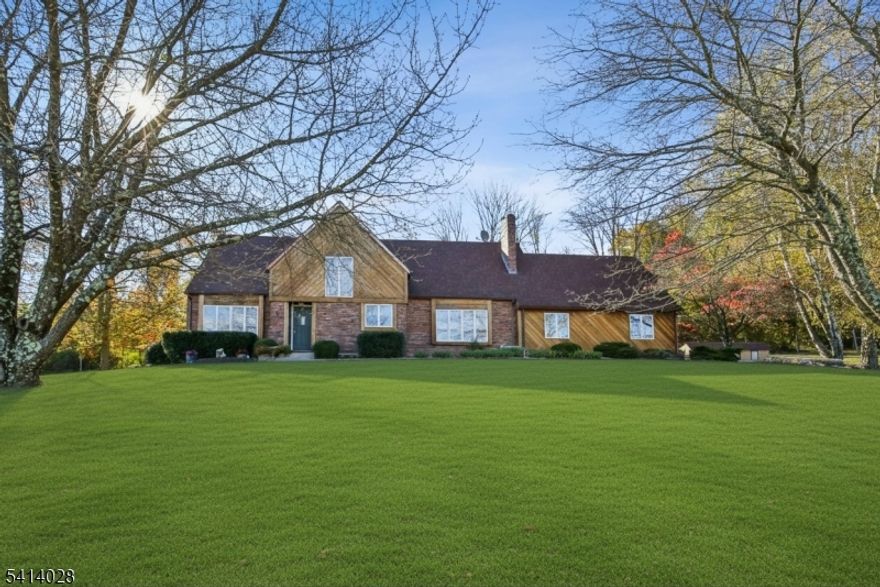 Nestled between green acres & rolling fields of farm land, this spacious & charming Colonial offers incredible views, unparalleled privacy & amply outdoor space. All minutes from downtown Chester. Travel down a private road through peach orchards, past fields of Jersey tomatoes, corn stalks and finally rows of pear trees until you arrive at the peaceful setting atop the hill. Each room within the home is both comfortable and bright. Large windows offer a glimpse of the surrounding beauty. A sliding glass door, off of the kitchen, steps down to a two tier patio with covered porch. All perfect for entertaining or simply enjoying the peace and serenity of life on a farm.