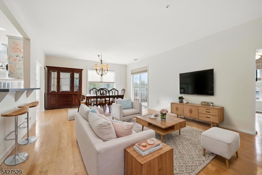 Beautiful Windsor E corner unit in the private Jackson Building, located within the highly desirable Fox Hills active 55+ gated community offering a resort-style lifestyle and outstanding amenities. This spacious 3rd-floor home features 2 bedrooms, 2 full baths, plus a flexible bonus room ideal for an office, den, or guest space. A welcoming foyer leads into a bright, open layout with wood flooring throughout the living and dining areas. The kitchen offers ample cabinetry, a breakfast nook, and an easy flow for everyday living and entertaining. The large primary suite features 2 walk-in California closets and an en-suite bath with a stall shower, double vanity, and soaking tub. The second bedroom is enhanced by gorgeous built-ins, adding both style and functionality. A coat closet, pantry, laundry closet, private balcony, 1-car garage, storage area, and additional outdoor parking complete this wonderful home. Fox Hills offers 24-hour gated security, elevators in each building and the clubhouse, shuttle/jitney service to shopping, and an impressive 25,000 sq. ft. clubhouse with indoor and outdoor pools, hot tubs, tennis/pickleball courts, fitness center, bocce, shuffleboard, billiards, card/game rooms, social clubs, greenhouse, and garden plots. Conveniently located minutes from Rockaway Mall, Atlantic Health facilities, dining, and major highways.