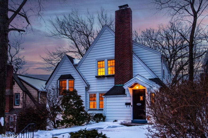 Welcome to this charming side-hall Colonial filled with cozy, original details. Enter through the rustic plank door into the vestibule and notice the delightful stained-glass window. The inviting living room features a wood-burning fireplace, perfect for game nights, quiet reading, or relaxing. From the living room, flow easily into the comfortable dining room and eat-in kitchen with a separate pantry room - great for everyday functionality and direct access to the fenced backyard. A half level up, you'll find a versatile bedroom with great natural light, easily configurable as a den or home office. The upper level offers two additional bedrooms and a large, full bathroom. An attached garage with storage provides everyday convenience, while the full unfinished basement offers excellent potential and already includes a half bath and laundry area. Outside the durable backyard paver patio is perfect for an evening entertaining under the stars. Whole house fan keeps things cool in the summer & newly installed boiler in 2025. A warm and welcoming home in an ideal location close to South Mountain Reservation & NJ Transit jitney service on the corner, providing commuter convenience. A wonderful opportunity to make this special home your own!