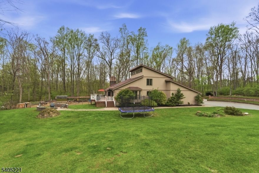 Just mins from the highway, yet a world away in the town often called, "NJ's best kept secret!" Private 26 acre retreat offers a combination of privacy, functionality & natural beauty--features increasingly hard to find.  Hidden from the road, this 26+ acre property provides unmatched seclusion w/a woodland management plan for added tax benefits. Ideal for those seeking space to live, work, & unwind, the land offers endless opportunities for recreation, homesteading, or simply enjoying the outdoors. The inviting  (approx) 2,800 sq ft home features soaring ceilings, abundant natural light, and thoughtful updates throughout, including an updated Kitchen and Baths, and hardwood flooring throughout. A flexible 1st Floor Bedroom with adjacent Full Bath is ideal for guests, a home office, or potential one-level living. Enjoy an oversized deck overlooking tranquil wooded surroundings perfect for entertaining or quiet mornings in nature.  The property also includes a walk-out basement, attached 2-car garage, detached oversized garage/workshop with separate electric and high-voltage capability, multiple outbuildings, and a chicken coop already in place. Predominantly wooded and exceptionally private, this property is designed for buyers who value space, versatility & lifestyle--without sacrificing everyday convenience.Predominantly wooded & exceptionally private, this property is designed for buyers who value space, versatility, and lifestyle without sacrificing everyday convenience.