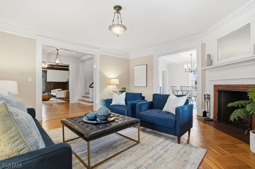 Calling all front porch lovers !!! Come see this fantastic 5/6 bedroom, 3.2 bathroom Dutch Colonial home resting on a fabulous professionally landscaped corner property conveniently located to both the thriving downtown of South Orange and the quaint Maplewood Village. The welcoming wrap around front porch certainly sets the tone for your enjoyment as you enter the home's stunning foyer. High ceilings, parquet floors, over-sized windows, leaded bookcases, pocket doors, freshly painted interior....The first floor offers a warm and inviting living room with wood-burning fireplace, beamed ceiling, leaded bookcases & pocket doors, a family room with wood-burning corner fireplace and direct access through French doors to the wonderful wrap around porch, sun-filled dining room w/beamed ceiling & pocket doors, butlers pantry/laundry room, renovated kitchen w/center island, and new powder room (2025). The second floor has a large primary suite with full walk-in dressing room/closet, and a striking primary bathroom plus 2 more very spacious bedrooms and a beautiful hall bathroom. The third floor offers 2 more bedrooms, an office/bedroom and full bath with soaking tub. Rounding out the lower level is a huge rec room, powder room, storage and utility area. Enjoy the beautiful property with a private, flat, fenced-in yard with 2 patios.  Stunning home, fabulous location, perfect for entertaining and day-to-day living.