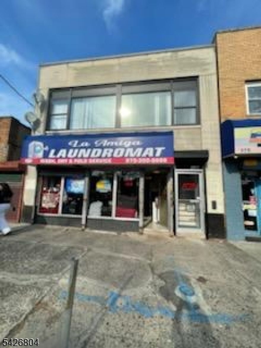 Well situated Commercial 4A 2 storey building consisting of 1,800 total s.f suitable for laundromat (plumbed for current use) or hair salon, with updated office (2025), full bathroom and kitchenette above. In the heart of the thriving Roseville section with lots of high visibility and foot traffic.. Second floor currently used as a trendy architect's office. Laundromat has below market rent currently. Office rent $2,500.