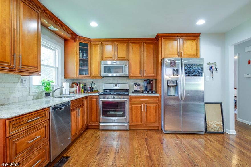 Large 4 bedrooms home with PRIVATE in-law suite on the first floor. newly renovated w/large eat-in kitchen, granite counter tops, SS appliances, 2.5baths,hardwood floors throughout, LR,DR, FR w/sliders to patio, private large backyard. All newer energy efficient windows and doors, ,laundry room washer/dryer, 2 car garage w/auto openers, central A/C, central vacuum. EXCELLENT SCHOOLS, Great development in the best area of Randolph Minutes from parks, Morristown train station, shopping, malls, restaurants, and easy access to major highways. small pet maybe ok with approval