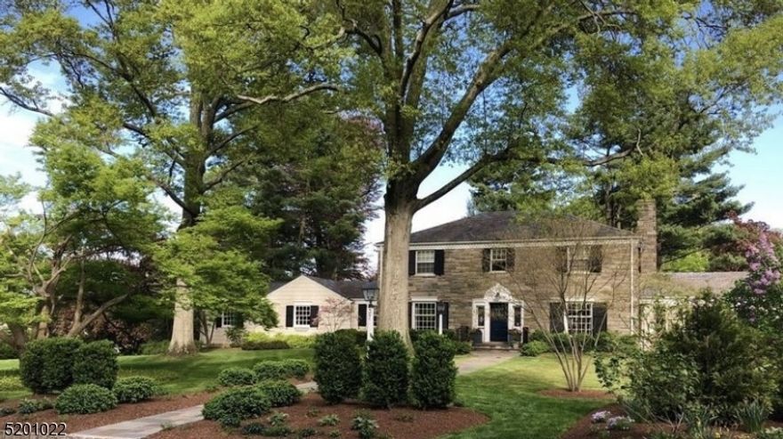 Welcome to this timeless beauty, situated behind "The Wall" in Madison's coveted Hill Section. This 5 BR, 3 BA, 3 half BA home has been stunningly designed while maintaining its period-appropriate charm. As soon as you step inside, you are welcomed by a generously sized foyer and a wide center hall.  The dining room is adjacent to a custom, gourmet kitchen which features a magnificent Danby marble countertop and backsplash, a large center island, designer lighting, and an eating area. All of this flows seamlessly into the incredible family room which hosts a stone-front wood-burning fireplace, a spectacular bay window with a window seat, and a bar area with a wine refrigerator and custom cabinetry. An inviting, yet, large living room with a gas fireplace, crown molding, and french doors to the screened patio, is the perfect spot for hosting just about any occasion. Off of the living room is a sun-drenched office with custom built-ins and french doors, opening to the bluestone patio, outdoor kitchen, and fire pit. The finished basement is another amazing area to entertain or lounge. Large enough for ping pong and pool table competitions, you might not get your guests to leave. Another "libation station" is perfectly situated on this level. The second floor has 5 BRs and 3 BA. The primary BR has a large custom walk-in closet and custom bathroom. All of this is showcased on nearly an acre of professionally designed landscape.