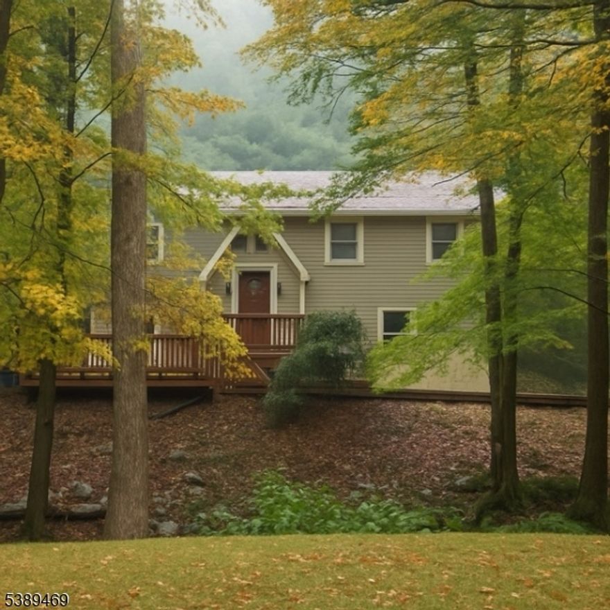 This beautiful bi-level Star Energy home offers 3 bedrooms and 2.5 baths on 3+ acres in a serene cul-de-sac setting, backed by state land for added privacy. The main level features high ceilings, hardwood floors, abundant natural light, a wood-burning fireplace, a newly updated kitchen, two renovated full baths, and newly carpeted bedrooms. The lower level includes a second wood-burning fireplace, a spacious TV room with sliders to a multi-level deck, a laundry room, ample storage, and a refreshed half bath. Outside, enjoy a fully fenced backyard and plenty of space to relax or entertain. The interior walls are all insulated for energy efficiency. Upstairs is propane heat, the lower level has new energy efficient electric baseboard. Conveniently located near Lake Mohawk and downtown Sparta, with quick access to schools, parks, shopping, and commuting routes. A must-see property.