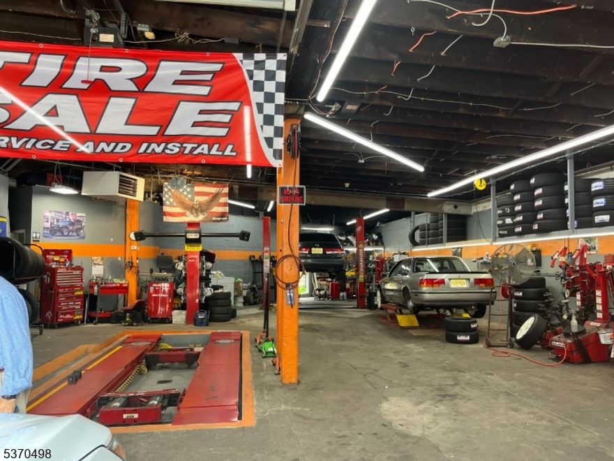 Great Investment Opportunity! Income-producing commercial building featuring 4 spacious units plus 8 garages. great for additional rentals. Fully occupied with long-standing tenants, this property offers immediate cash flow and strong rental history. Ideal for both investors and owner-occupants looking to maximize return. Don't miss your chance to own this asset in a desirable, high-demand location.