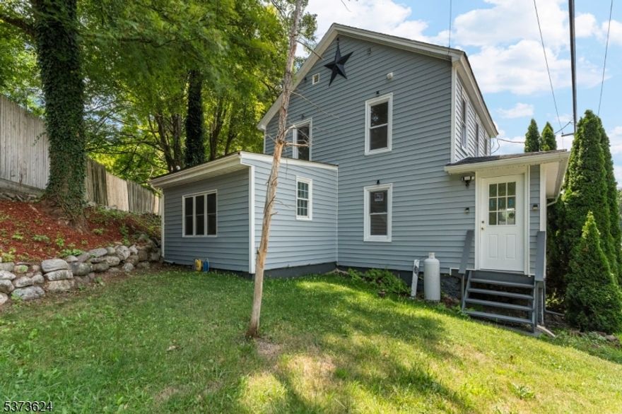 Looking for a renovated home that can serve as your primary residence, weekend escape, or investment property? This beautifully updated colonial offers flexibility with three bedrooms plus a spacious bonus room on the main level perfect for a bedroom, office, or guest space. (Note: Home is serviced by a 3-bedroom septic system per township records.)Tucked away in the peaceful northern corner of New Jersey, near the scenic borders of Pennsylvania and New York, this home combines rural tranquility with modern comfort. Thoughtfully renovated in 2025, it preserves its timeless character while providing today's conveniences. Recent updates include a brand-new roof, renovated bathrooms, and all-new utilities, giving you peace of mind in a move-in-ready home.Inside, you'll find a warm and inviting layout with classic colonial details enhanced by modern finishes. The expansive yard offers plenty of space to garden, relax, or entertain under the open sky. Whether you're seeking a full-time residence or a weekend retreat, this property delivers the perfect blend of history, charm, and comfort just a short drive from the Pocono Mountains and the Catskills.