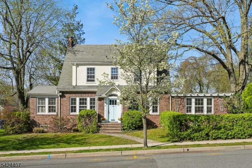 This charming, impeccable Maplewood center hall colonial is just waiting for you to make it your own! Located in the lovely, tree-lined College Hill neighborhood, this 3-bed/2.1 bath home is walking distance to shops, restaurants, library, and parks, with convenient jitney access to Maplewood train station with service to NYC and Hoboken. The lovely front yard is brimming with curb appeal. Upon entry, you'll notice the beautiful hardwood floors and abundant light. The spacious living room features a cozy wood-burning fireplace. Adjacent "Maplewood room  provides added space for a family room, home office, play room " use your imagination! The large kitchen features a separate breakfast bar. There's also a good-size formal dining room, an oversized family room, and a mudroom. A large powder room with multiple closets completes this floor. Upstairs there are three bedrooms each with multiple closets plus a full hall bath. Downstairs, the finished basement offers a large rec room, office, gym area, laundry, and a full bath. Outside, relax on the deck overlooking the backyard. Your new home awaits!