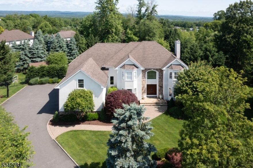 Welcome to resort living in this preferred neighborhood of Warren Township,where every detail of this 4 bdrm, 4.5 bath, 3 car garage colonial showcases elegant design,renovated baths & newly finished basement,and newer lush backyard oasis resting on a .89 acre private lot and cul-de-sac.Step inside to discover a grand 2-story foyer flanking an elegant dining room and a billiard/living room.The chef kitchen features a large center island, breakfast room, designer lighting, granite counters, marble backsplash, high end appliances, and custom cabinets.The kitchen is open to the expansive 2-story family room that has abundant light and a gorgeous fireplace with custom moldings.The second floor offers 4 generous sized bedrooms, including the primary hotel style suite with a vaulted ceiling, a sitting area, a large designer walk in closet, and a spa like marble bathroom with double vanity, walk in steam shower and soaking tub, and 2 additional updated bathrooms.The newly renovated lower level offers a sprawling recreational room for entertaining, a full bath, an exercise room and a utility room with storage.This outdoor area is a dream, with a sprawling deck with built in lighting and outdoor kitchen, bluestone patio, an 8 seat hot tub, outdoor pavilion, gas fire-pit area, gorgeous manicured grounds with landscape lighting.This home is TURN KEY! DREAM location, just 5 minutes to top rated schools,including Pingry School,and close to all major highways and shopping.