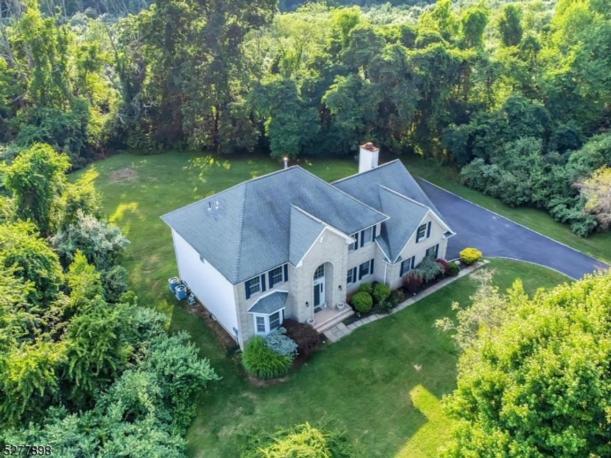 Colonial in fantastic neighborhood is set on open and level lot and backs to town park!  Two story ceramic tile foyer, large eat in kitchen with center island is open to family room with vaulted ceiling and wood burning fireplace.  Formal living and dining rooms offer hardwood flooring and the perfect space for entertaining.  First floor laundry, powder room and home office complete the main living space.  On the upper level, double doors lead you to the primary suite  with 2 walk-in closets, recessed lighting and primary bath with tub, stall shower and dual vanity. Basement is unfinished, bring your imagination!  HVAC in 2023, new hot water heater, natural gas, awesome Randolph Twp. schools.  Mendham 07945 mailing address.